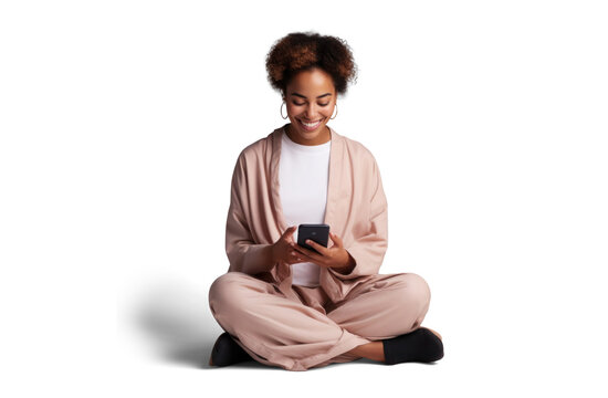 black woman sits on the floor and joyfully watching smart phone, png file of isolated cutout object with shadow on transparent background.