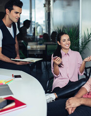 Happy men and woman enjoying work break for talking about personal things