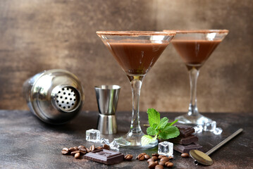 Delicious chocolate coffee martini with mint in a glasses .