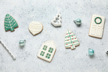 Composition with sweet Christmas cookies and decorations on light background