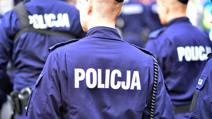 Police sign - logo on the back of the police uniform. Policja. - obrazy, fototapety, plakaty