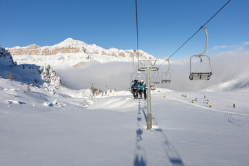 Winter ski lift high in Dolomite mountains