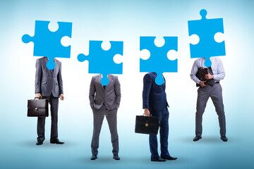 Concept of business people and jigsaw puzzle