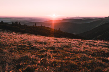 Beautiful nature sunset over horizon on peaks of mountain Krkonose, sunrise, Europe, Czech Republic, mountains, hills, wide landcape
