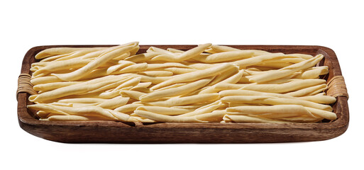 Maccheroni al Feretto noodle in wooden bowl isolated on white, close up