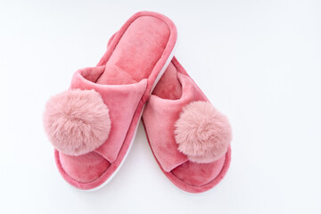 Pink home fluffy slippers on white background