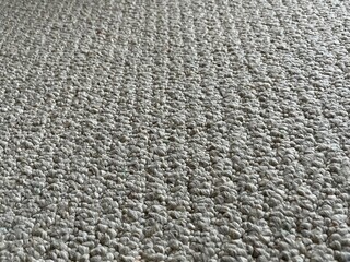Closeup of white carpet at an angle