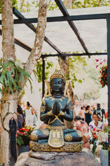 lakshmi buddha figurine in black and gold
