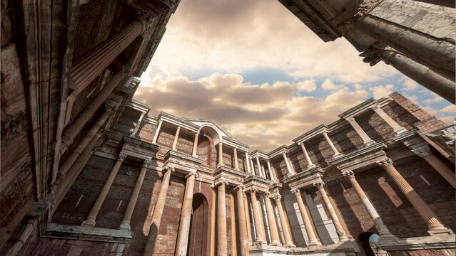 Sardes of Manisa Turkey with time lapse of sunset clouds and gymnasium building