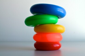 A small tower built with coloured toy circles.