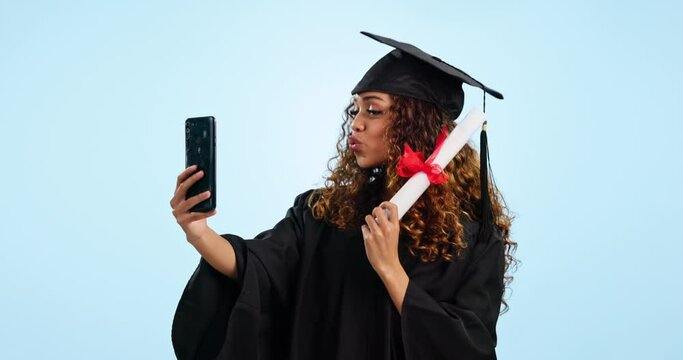 Happy woman, student and selfie with graduate certificate in photography against a blue studio background. Excited female person smile for graduation photograph, picture or memory with diploma