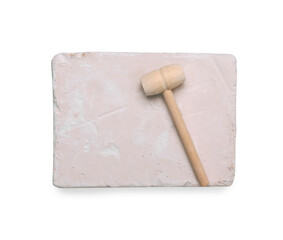 Educational toy for motor skills development. Excavation kit (plaster and wooden mallet) isolated on white, top view