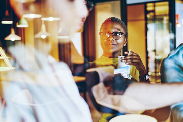 young male and female hipsters talking and discussing ideas teamworking on startup