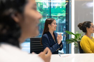 Business meeting with a successful moment. A group of diversity business people colleagues applause, clapping hands and hand closed fist show up for hitting the sale's target.