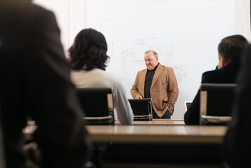 Group of diverse employees business people team during a brainstorming meeting. Multiracial coworkers discussing about a new project at meeting room in the office.