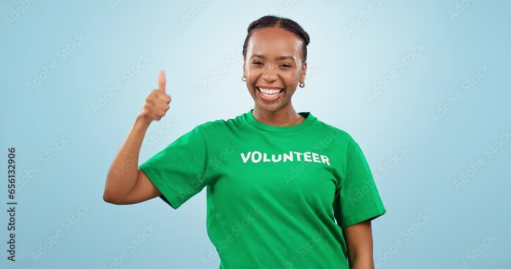 Poster Happy black woman, volunteer and thumbs up in success, choice or you in community service against a studio background. Portrait of African female person smile and like emoji, yes sign or volunteering