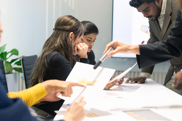 Fototapeta premium Group of diverse employees business people team during brainstorming. They are discussing new ideas for the new project. Multiracial coworkers colleagues.