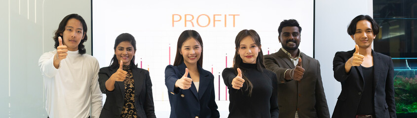 Group of diversity workers showing their confident, thumbs up posture. Successful business teamwork colleagues standing and smiling together.