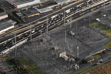 Aerial Perspective of Power Substation Alongside Major Highway