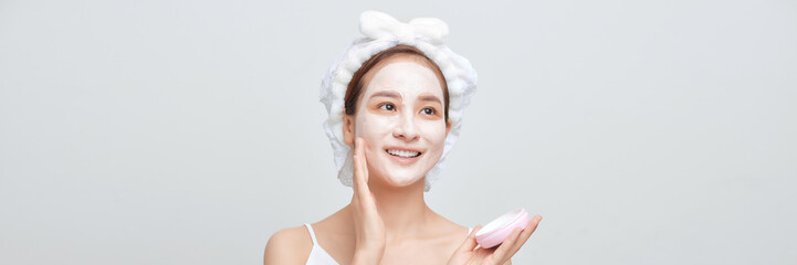 Beautiful woman with cosmetic mud facial procedure, spa health concept, banner - 656168340