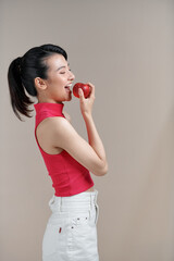Portrait of young beautiful happy smiling woman with red apples.