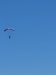 Fototapeta na wymiar Parachuter in the sky