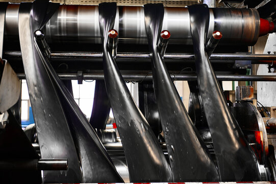 Black rubber ribbons rolled by tool at compound calendering