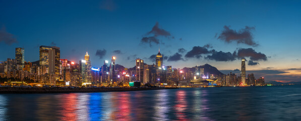 Fototapeta na wymiar Panorama of Victoria harbor of Hong Kong city at dusk