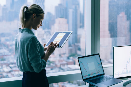 Professional businesswoman using tablet in office