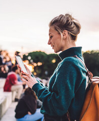 Attractive female tourist walking around city