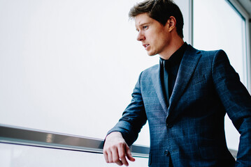 pensive confident caucasian businessman in elegant suit concentrated on ideas for work