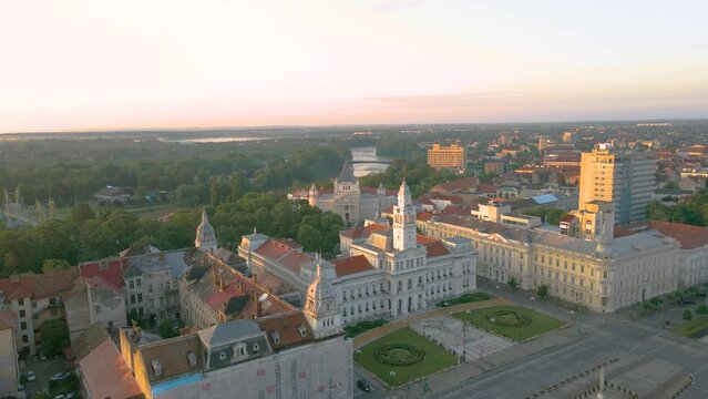 Aerial footage over Arad city center with the Administrative palace in the view. Video was shot from a drone, in the morning, while banking right with the Administrative palace in the view.