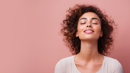 A woman closed eyes breathes relaxedly isolated on pastel background - obrazy, fototapety, plakaty