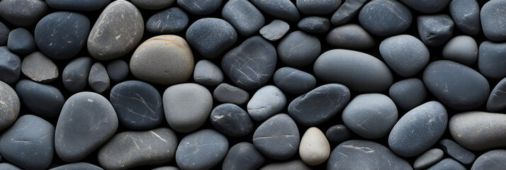 black smooth oval pebbles background