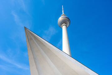 The famous Television Tower in Berlin with a part of the base structure - obrazy, fototapety, plakaty