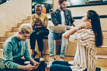 group of male of female hipsters spending time together share creative ideas and networking