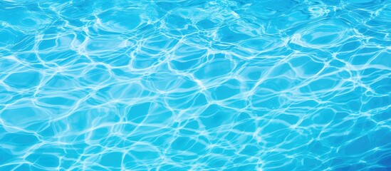 Obraz premium Summer background featuring the textured surface of a blue swimming pool