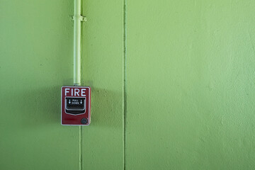 fire alarm switch on green background