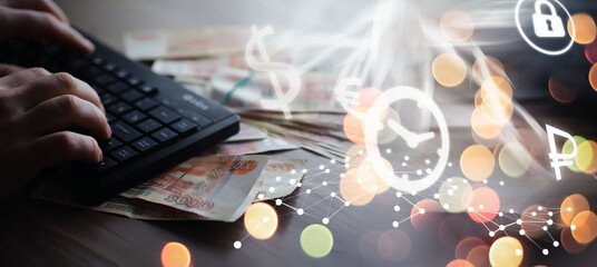 Russian rubles are on the table next to the computer, Notepad in the office or Bank. Savings and...