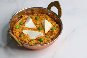 Famous Indian curry dish Paneer matar masala. vegetarian North Indian dish consisting of peas and paneer in a tomato based sauce, spiced with indian spices and garam masala. peas and cottage cheese. 