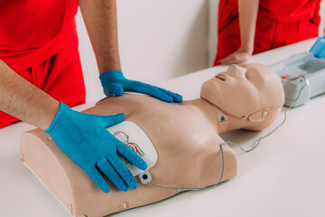 AED first aid resuscitation course. Life saving skills in a first aid resuscitation course using an AED