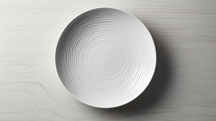 Empty white plate on the table in the kitchen