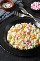Ambrosia Salad in black bowl, top view