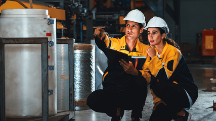 Two factory workers or engineers conduct professional inspection on machine or procedure in chemical plant, chemistry factory workplace and industrial profession concept. Exemplifying - obrazy, fototapety, plakaty
