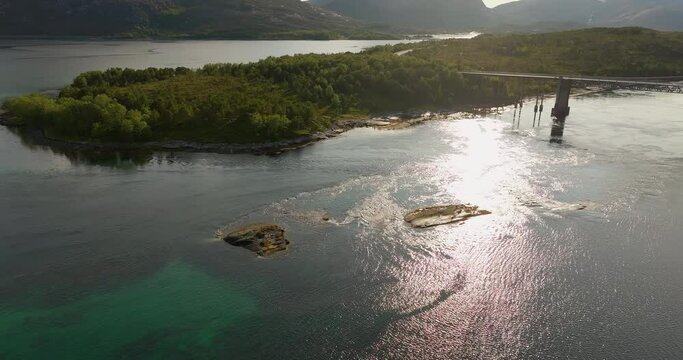 Kjerringstraumen Bridge Over Glistening Water Of Efjorden At Dawn In Nordland County, Norway. Aerial Drone Shot