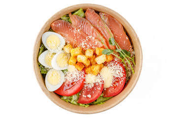 Caesar salad with salmon, on a white background, studio shot 1