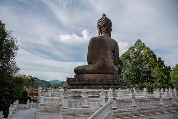 Fototapeta premium Phra Phuttha Thammakaimongkon Phrayoonkesanonsupphithan is the name of the largest bronze Buddha statue in Thailand at Wat Phuttha Thiwat Temple, Betong, Yala