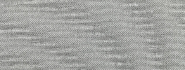 Texture of gray color background from textile material with wicker pattern, macro. Vintage fabric grey cloth,