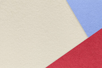 Fototapeta premium Texture of craft light beige color paper background with blue and red border. Vintage abstract sand cardboard.