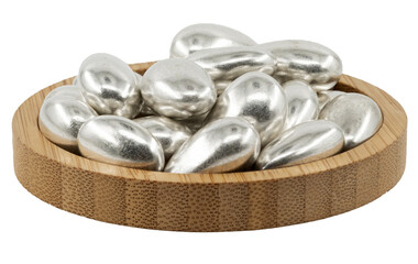 silver almond dragees in a wooden bowl